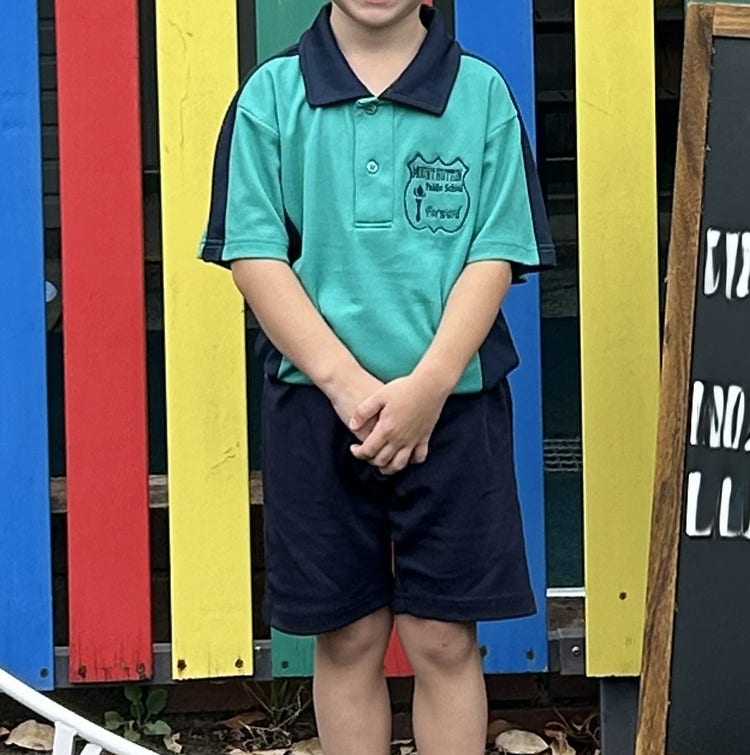 Photo of student in a school polo and shorts